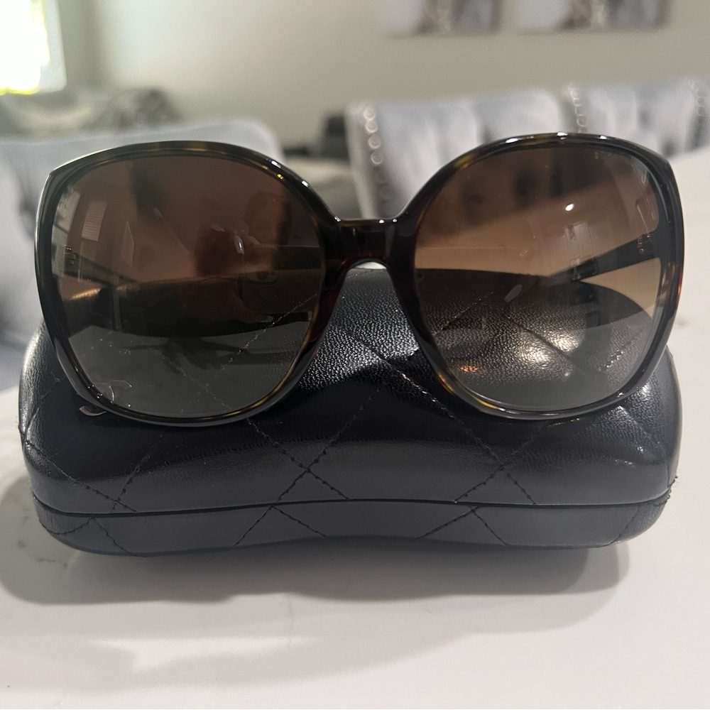 Authentic Chanel sunglasses with case .